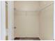 Walk-in closet with wire shelving and grey vinyl flooring, offering ample storage space at 294 San Gabriel St, Winter Springs, FL 32708