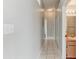 Hallway view featuring tile flooring, neutral walls, and access to the bathroom and bedrooms at 294 San Gabriel St, Winter Springs, FL 32708