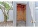 Open shed with plywood walls and concrete floor, positioned next to a leafy tree at 294 San Gabriel St, Winter Springs, FL 32708