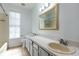 Bathroom with a double sink vanity and a bathtub, creating a functional space to get ready in the morning at 321 Moffat Loop, Oviedo, FL 32765