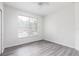 Bright bedroom with natural light, a ceiling fan, and wood-look floors, creating a comfortable ambiance at 321 Moffat Loop, Oviedo, FL 32765