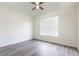 Bedroom with neutral paint, a ceiling fan, wood-look floors, and plenty of natural light, making it cozy at 321 Moffat Loop, Oviedo, FL 32765