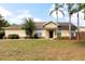 Attractive one-story home boasting manicured lawn, palm trees, and inviting curb appeal at 321 Moffat Loop, Oviedo, FL 32765