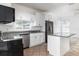Bright kitchen with granite countertops, stainless steel appliances, and ample cabinet space at 321 Moffat Loop, Oviedo, FL 32765