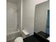 Bathroom with a full tub, toilet, sleek mirror and a modern sink at 3296 Tranquil Trl, Kissimmee, FL 34747