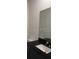 Modern bathroom featuring a white sink with black countertop and mirror at 3296 Tranquil Trl, Kissimmee, FL 34747