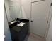 Bathroom with a sleek mirror, modern sink and white walls at 3296 Tranquil Trl, Kissimmee, FL 34747