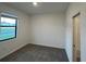 This bedroom features a large window and hardwood floors at 3296 Tranquil Trl, Kissimmee, FL 34747