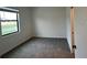 Cozy bedroom with neutral walls, carpeted floors, and ample natural light from window at 3296 Tranquil Trl, Kissimmee, FL 34747