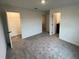 Spacious carpeted bedroom with walk-in closet and ensuite bathroom at 3296 Tranquil Trl, Kissimmee, FL 34747
