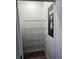 A closet featuring metal racks for organization at 3296 Tranquil Trl, Kissimmee, FL 34747
