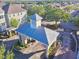 Aerial view of gated community entrance, with lush landscaping, and easy access at 3344 Corona Village Way # B4, Orlando, FL 32835