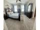 Spacious bedroom features a large bed, decorative headboard, and ample natural light at 3344 Corona Village Way # B4, Orlando, FL 32835