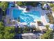 Community pool area with multiple pools, hot tub, gazebos, and lounge seating at 3344 Corona Village Way # B4, Orlando, FL 32835