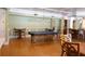 Community game room featuring a billiard table and gathering space with tables and chairs at 3344 Corona Village Way # B4, Orlando, FL 32835