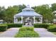 Beautiful gazebo surrounded by manicured landscaping and walking paths in a serene community setting at 3344 Corona Village Way # B4, Orlando, FL 32835