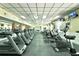 Well-equipped gym features rows of treadmills and exercise bikes with ceiling fan at 3344 Corona Village Way # B4, Orlando, FL 32835