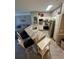 Well-lit kitchen features stainless steel appliances and granite counters at 3344 Corona Village Way # B4, Orlando, FL 32835