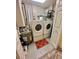 Functional laundry room equipped with a washer, dryer, and utility sink at 3344 Corona Village Way # B4, Orlando, FL 32835
