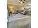 Inviting living room with comfortable seating, ceiling fan, and access to sliding glass doors at 3344 Corona Village Way # B4, Orlando, FL 32835