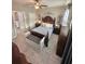 Comfortable main bedroom featuring a ceiling fan, neutral paint, and an ensuite bathroom at 3344 Corona Village Way # B4, Orlando, FL 32835