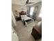 The bright main bedroom boasts beautiful floors, a ceiling fan, and great style at 3344 Corona Village Way # B4, Orlando, FL 32835