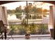 Relaxing patio view overlooking a pond with a fountain and lush greenery at 3344 Corona Village Way # B4, Orlando, FL 32835