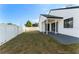 View of backyard, including white fence, patio, and a portion of the home's exterior at 368 Morning Glory Dr, Lake Mary, FL 32746