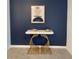 Stylish decor includes a sleek table with a marble top and artistic metal frame at 8895 Cabot Cliffs Dr # 103, Davenport, FL 33896