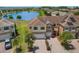 Aerial view of a home with solar panels overlooking a beautiful lake at 1969 Portofino Meadows Blvd, Orlando, FL 32824