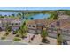 Areal view shows a home with solar panels and a picturesque lake, showcasing community living at 1969 Portofino Meadows Blvd, Orlando, FL 32824