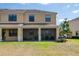 A well-maintained backyard with a screened lanai, offering a private outdoor space at 1969 Portofino Meadows Blvd, Orlando, FL 32824