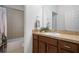 Bathroom featuring a vanity, sink, and bathtub with tile surround at 1969 Portofino Meadows Blvd, Orlando, FL 32824