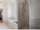 Bathroom showcasing a bathtub and a separate glass-enclosed shower at 1969 Portofino Meadows Blvd, Orlando, FL 32824