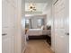 View from doorway of well-appointed bedroom with tray ceiling, ample natural light, and plush carpet at 1969 Portofino Meadows Blvd, Orlando, FL 32824