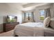 Relaxing bedroom with serene views, comfortable furniture, and modern interior design at 1969 Portofino Meadows Blvd, Orlando, FL 32824