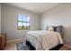 Cozy bedroom featuring a bed and a large window with a view at 1969 Portofino Meadows Blvd, Orlando, FL 32824