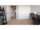 Bedroom with neutral walls, carpeted floor, and open closet space at 1969 Portofino Meadows Blvd, Orlando, FL 32824