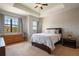 Comfortable bedroom featuring a ceiling fan, large windows, and plenty of natural light at 1969 Portofino Meadows Blvd, Orlando, FL 32824