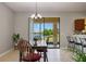 Cozy dining area with backyard view and a stylish chandelier, perfect for Gathering gatherings at 1969 Portofino Meadows Blvd, Orlando, FL 32824