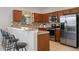 Well-equipped kitchen featuring stainless steel appliances, granite countertops, and a stylish backsplash at 1969 Portofino Meadows Blvd, Orlando, FL 32824