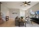 Comfortable living room with tile floors, a ceiling fan, and an open staircase at 1969 Portofino Meadows Blvd, Orlando, FL 32824