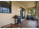 Patio featuring outdoor grill, furniture, and sliding door access at 1969 Portofino Meadows Blvd, Orlando, FL 32824