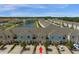 Community aerial shot featuring pond, manicured landscaping and convenient parking at 4730 Coral Castle Dr, Kissimmee, FL 34746