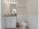Clean and well-lit bathroom with granite vanity and tiled floors at 4730 Coral Castle Dr, Kissimmee, FL 34746