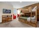 bedroom features bunk beds, desk, chair and television at 4730 Coral Castle Dr, Kissimmee, FL 34746