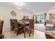 Cozy dining room with views of a tranquil lake from sliding glass doors at 4730 Coral Castle Dr, Kissimmee, FL 34746