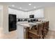 Beautiful modern kitchen features sleek white cabinets and a granite island at 4730 Coral Castle Dr, Kissimmee, FL 34746