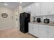 Bright kitchen featuring white cabinetry and stainless steel appliances at 4730 Coral Castle Dr, Kissimmee, FL 34746