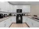 Bright, modern kitchen with white cabinets and tile backsplash at 4730 Coral Castle Dr, Kissimmee, FL 34746